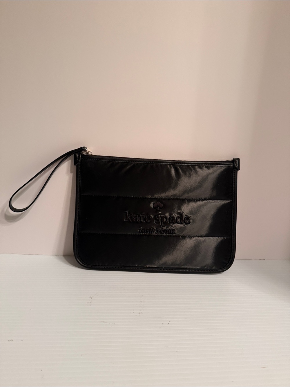 kate spade black quilted wristlet clutch with embossed logo